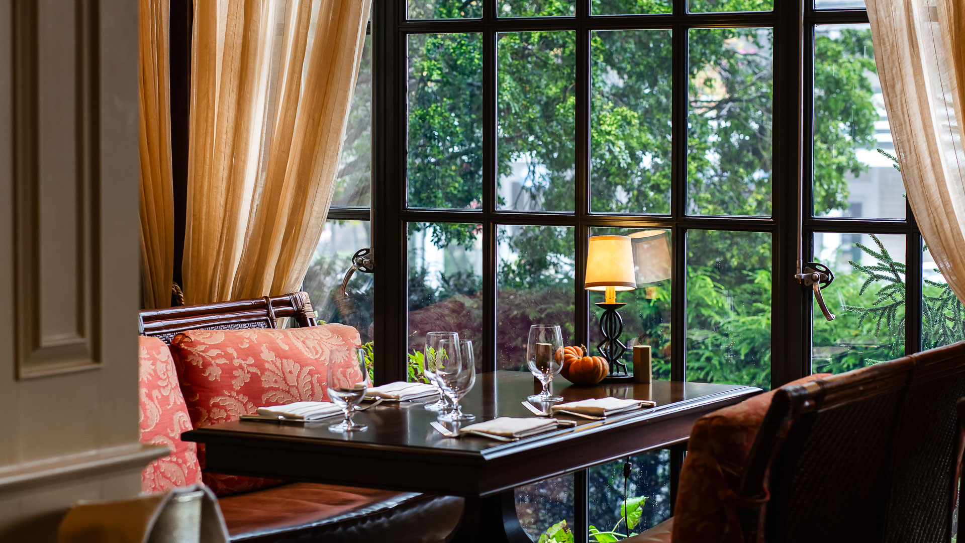 Intimate dining table by a window with nature views at a luxury mountain retreat