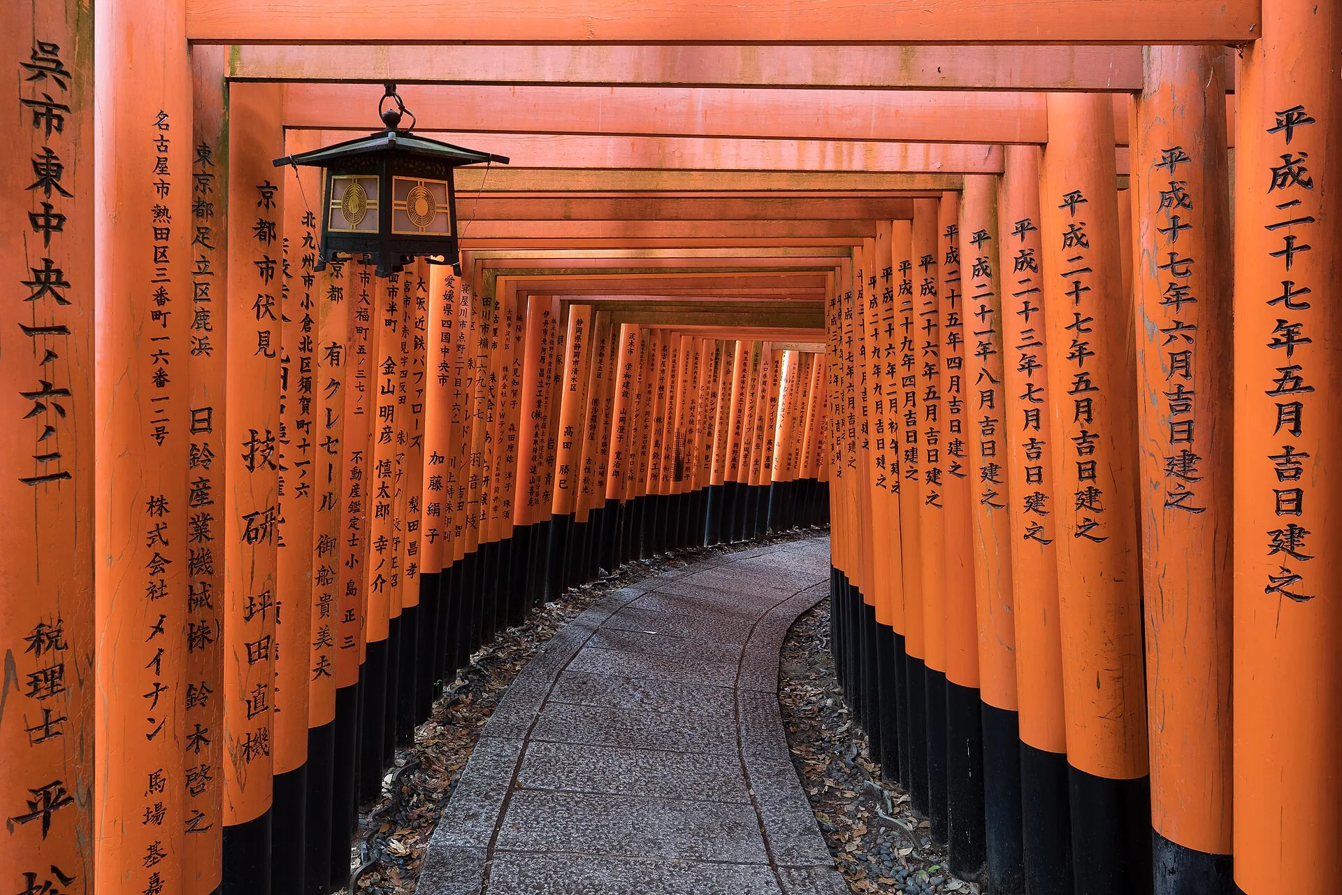 The vermilion torii gate tunnel at Fushimi Inari Shrine in Kyoto, Japan