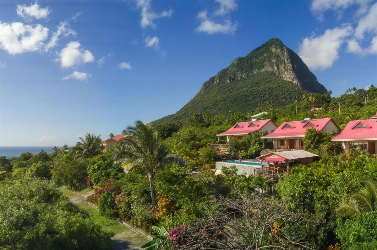 The six suites of Tet Rouge Resort tucked into the hillside beneath Gros Piton